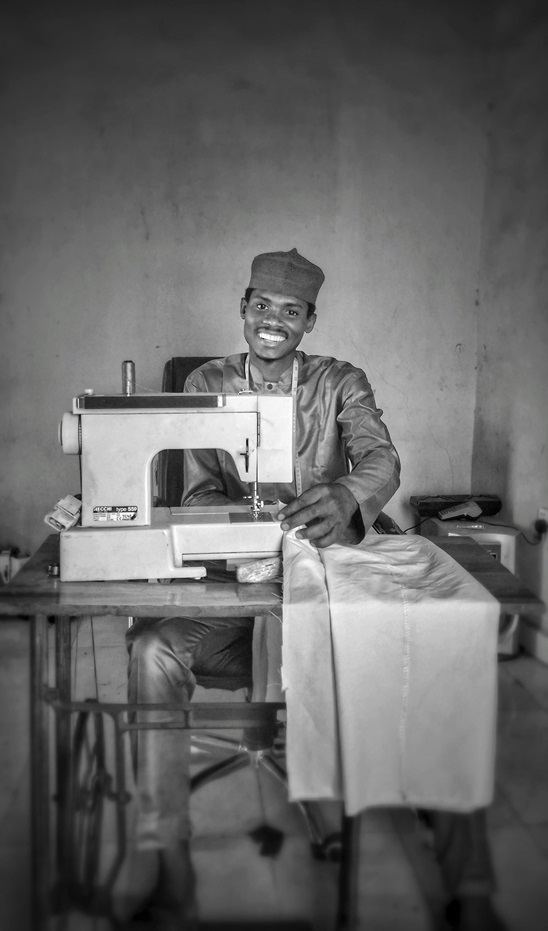 A tailor at a sewing machine
